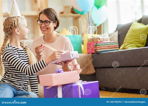 Opening Birthday Gifts with Mom Stock Photo - Image of childhood, home: 150738292