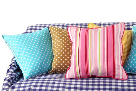 Premium Photo | Colorful pillows on couch isolated on white