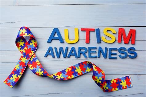 Premium Photo | World autism awareness with puzzle pattern ribbon