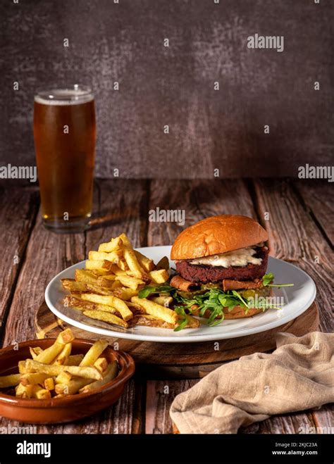 Food photography of vegan burger, hamburger, fries, beer Stock Photo ...