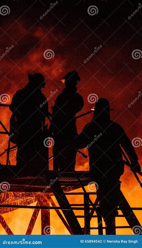 Three Firefighters On Fire Scene Walking Into A Building Royalty-Free ...