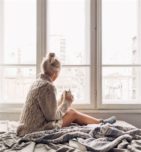 "Blonde Woman Drinking Morning Coffee In Bed" by Stocksy Contributor "Lumina" - Stocksy