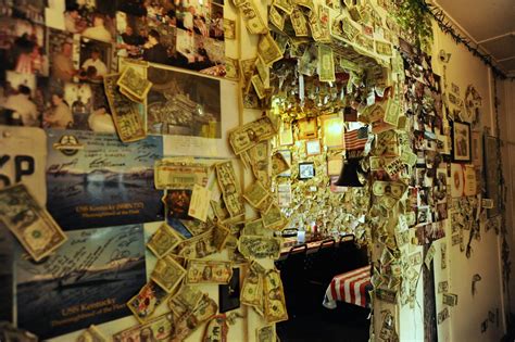 Dollar bills posted to the door frame, American flag table… | Flickr