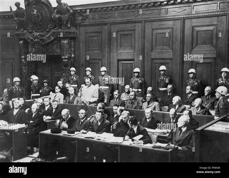 NUREMBERG TRIALS (1945-1946). /nHermann Goering, standing, with Rudolf ...