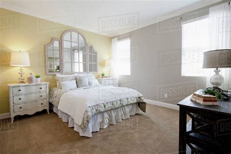 Interior of tidy bedroom - Stock Photo - Dissolve