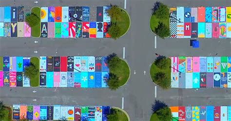 High school seniors paint parking spaces into beautiful works of art