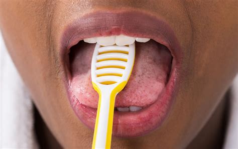 Tongue Scraping: 4 Benefits & How To