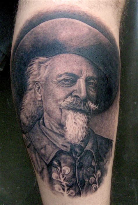 an old man with a beard and mustache tattoo on his leg