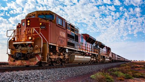 BHP SD70ACe hauling iron ore train in North-Western Australia. They can ...