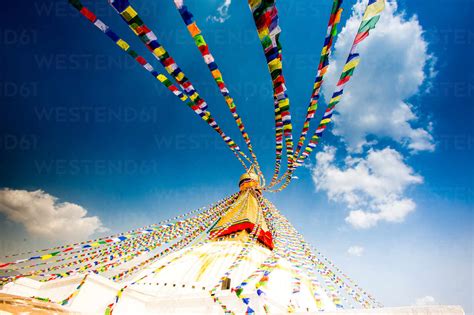 Prayer flags and Buddhist stupa at Bouddha (Boudhanath), UNESCO World Heritage Site, Kathmandu ...