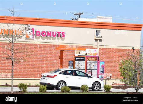 Dunkin' Donuts donut shop drive thru and drive thru menu Stock Photo - Alamy