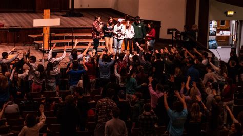 Auburn students rush into lake for impromptu baptisms as football coach lends a hand at massive ...