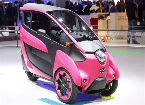 A three wheel design and ultra compact Toyota I-Road electric car is displayed on media day at ...