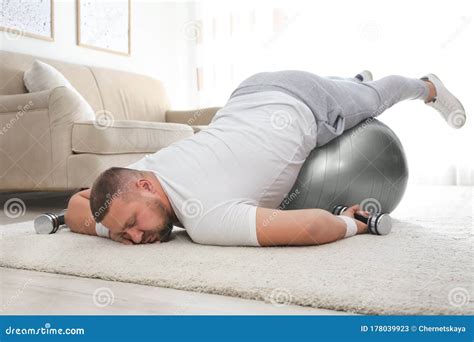 Lazy Overweight Man with Sport Equipment Sleeping on Floor Stock Image ...