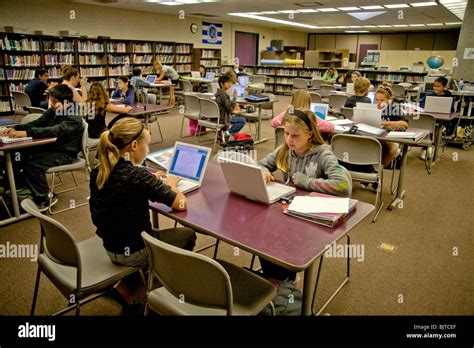 Sitting at laptop computers, California middle school students write ...