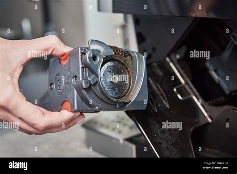 Automatic coffee machine cleaning. Woman cleans mechanism inside coffee ...