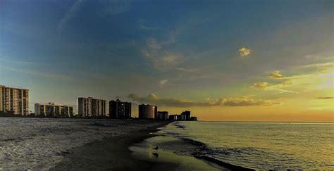 Sunset on Sand Key Beach Photograph by Laura Putman - Fine Art America