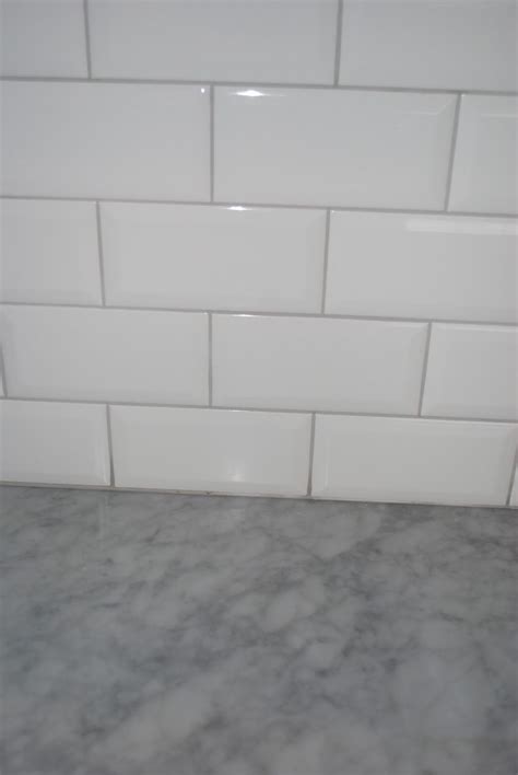 white floor tiles with grey grout - Eldon Havens