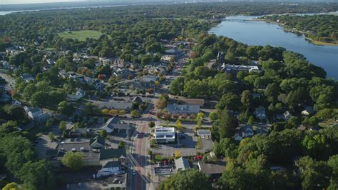 6k stock footage aerial video flying by County Road, neighborhoods, shops, Barrington, Rhode ...