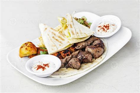 Traditional Middle Eastern food mixed BBQ barbecue grilled meat platter ...