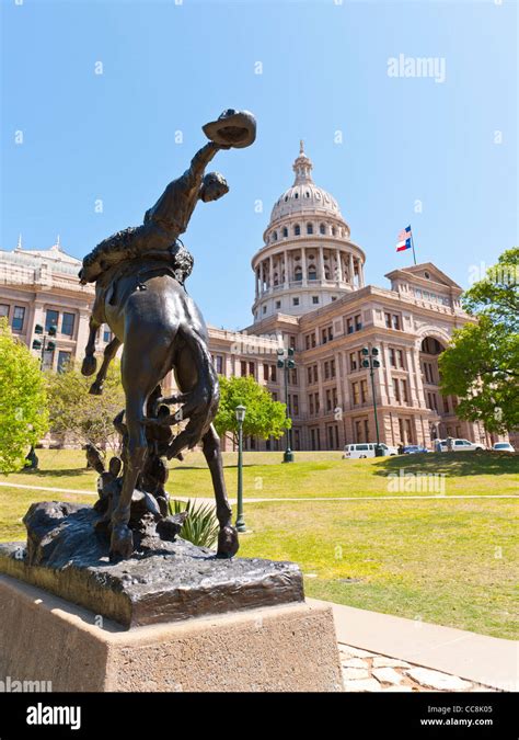 Texas cowboy statue & state Capitol, Austin, TX Stock Photo - Alamy