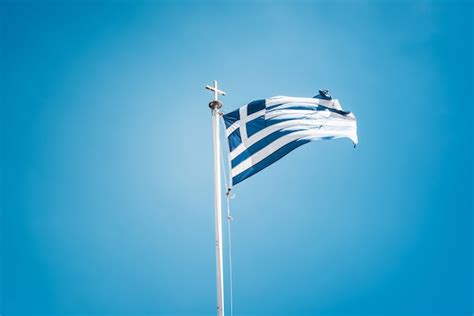 Premium Photo | Greek flag waving against blue sky