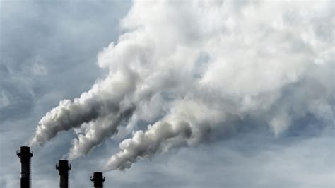 Toxic emissions of toxic gases into the atmosphere, industrial air pollution. Dark chimneys ...