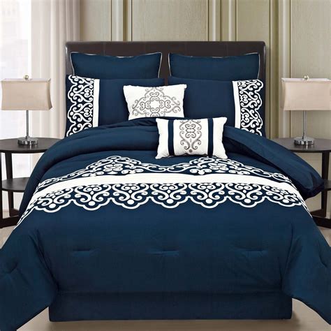 This royal blue bedding set features a white motif pattern on the dark blue color. | Pinterest ...