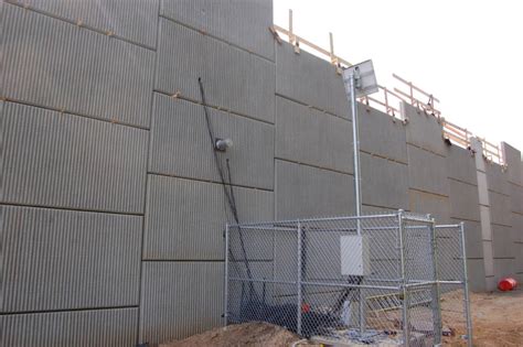 Instrumented MSE wall reinforced with polyester straps - Geosynthetics ...