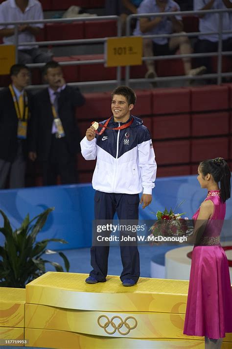 USA Henry Cejudo victorious on medal stand after winning Men's... News Photo - Getty Images