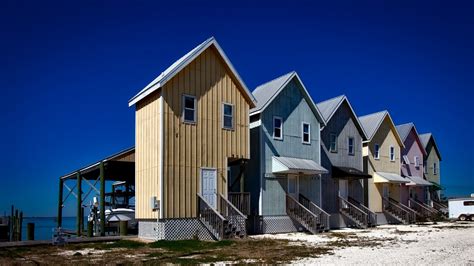 Free Images : beach, sea, sand, ocean, architecture, wood, boat, house, town, wind, building ...