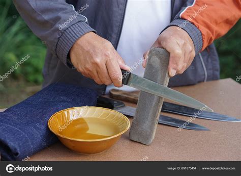 Closeup Man Hands Sharpen Knife Whetstone Sharpener Grindstone Concept ...