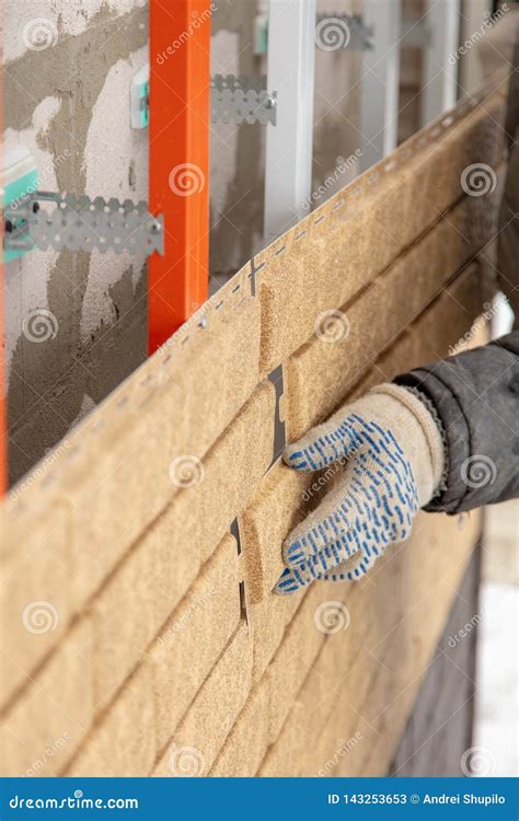 Installing Brick Siding on the Wall of the House Stock Image - Image of install, wall: 143253653