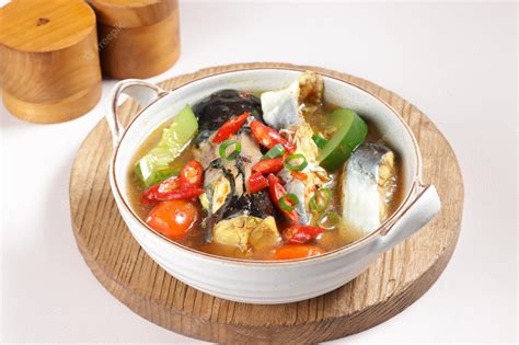 Premium Photo | Gulai ikan patin pahang is a malay traditional curry made from pangasius fish ...