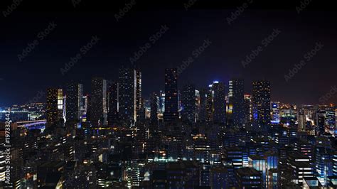 Futuristic city skyline at night time. Stock Photo | Adobe Stock