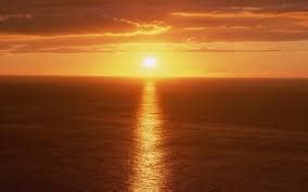 optics - Why does sunset over a body of water cause a path of light stretching towards the ...