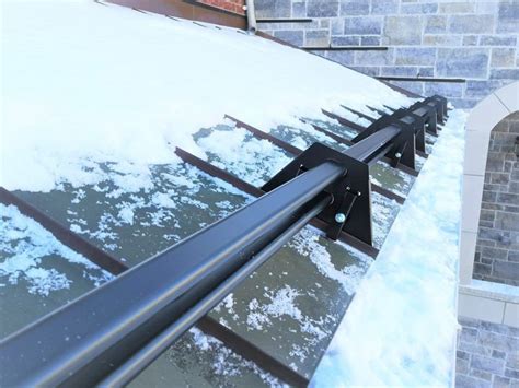 How to stop snow from sliding off metal roof? - Metal Roof Experts in ...