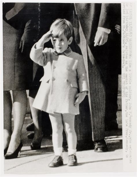 [John F. Kennedy Jr. saluting his father's casket as it is carried from ...