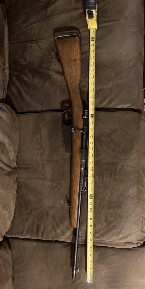 Need help identifying this carcano rifle. : r/guns