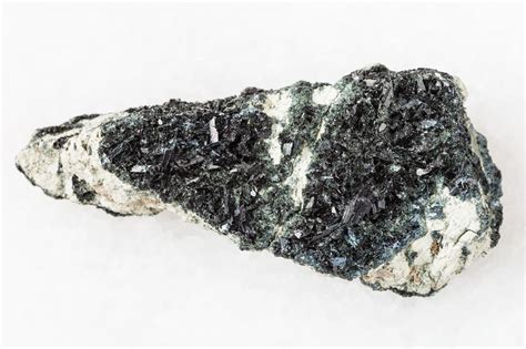 Premium Photo | Crystal of hornblende on amphibolecarbonate rock