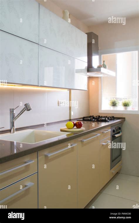 Modern kitchen interior in beige and cream colors Stock Photo - Alamy