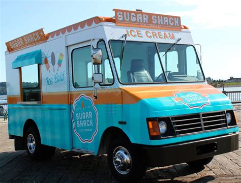 an ice cream truck is parked on the pier