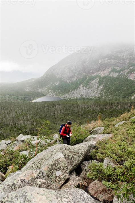 Person hiking in the mountains 7400793 Stock Photo at Vecteezy