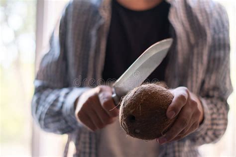 Person with Big Knife Try To Open and Break a Coconuts Stock Photo ...