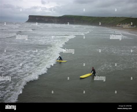 Surfers in saltburn hi-res stock photography and images - Alamy