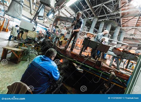 Minsk, Belarus - February 01, 2018: Glass Factory Workers on Production of Glass Background ...