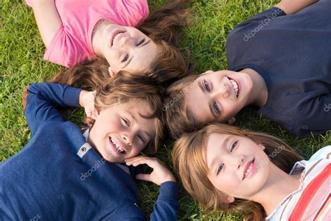 Kids lying on grass — Stock Photo © jolopes #84387486