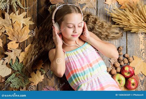 Relaxing Music for Kids. Cute Child Enjoy Music Playing in Earphones. Small Girl Wearing Stereo ...