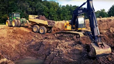 Digging a Pond: The Deep Cut! - The John Deere 200D Excavator Digs Down ...