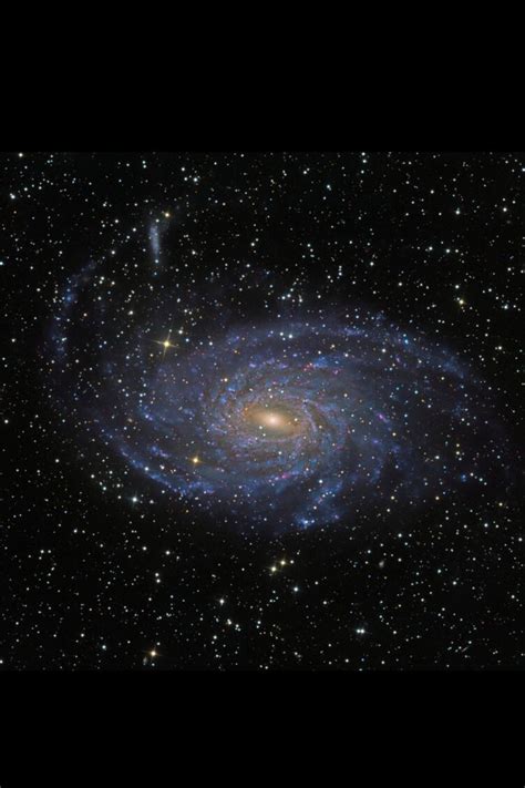 an image of a spiral galaxy in the sky